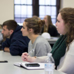Students listening to an alumnus